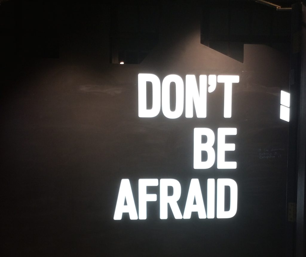 The words Don't Be Afraid, lit up at the end of the Seamus Heaney exhibition.