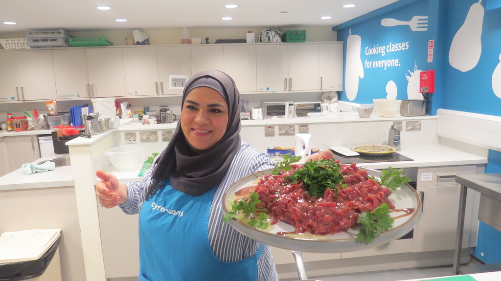 Online Syrian Supper Club: Nouri presents a dish to the camera