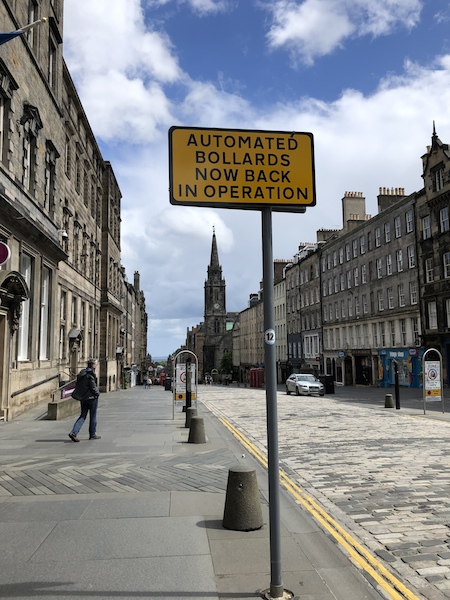 In lockdown, an empty Royal Mile: a street sign proclaims 'Automated Bollards Now Back in Operation': picture Fay Young
