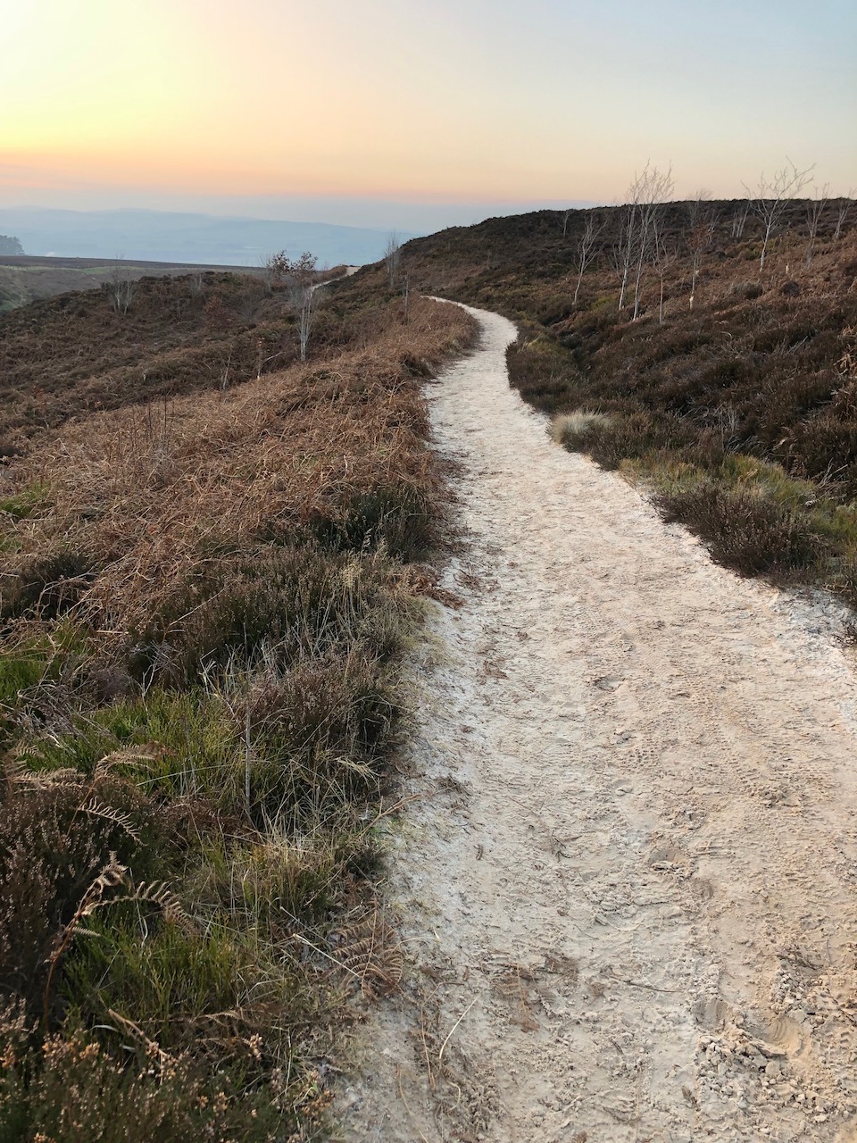 A path winds uphill, views across Loch Leven: photo Fay Young