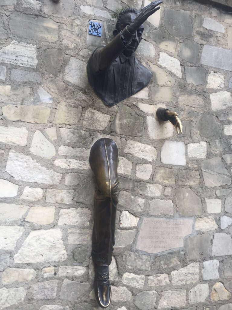 The man who walked through walls – the Jean Marais sculpture in Montmartre pays tribute to the story by Marcel Ayme. Photo Fay Young