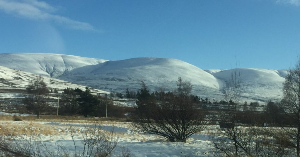 Deceptively soft, seen from a distance, the rounded snow-clad summits of Dalwhinnie Munros: photo Fay Young