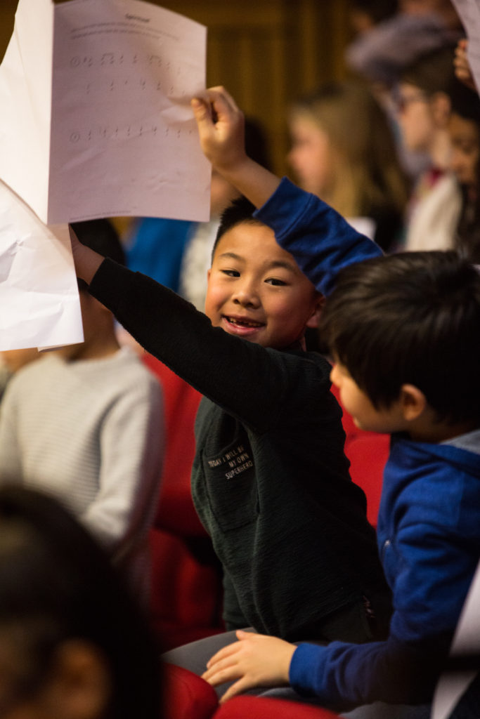 Smiling children wave music scores, Featured image: Juniors of Royal Conservatoire of Music. Photo Robert McFadzean courtesy Royal Conservatoire of Music