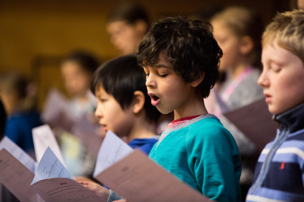 Children singing from song sheets; image Royal Conservatoire of Scotland, photographer Robert McFadzean