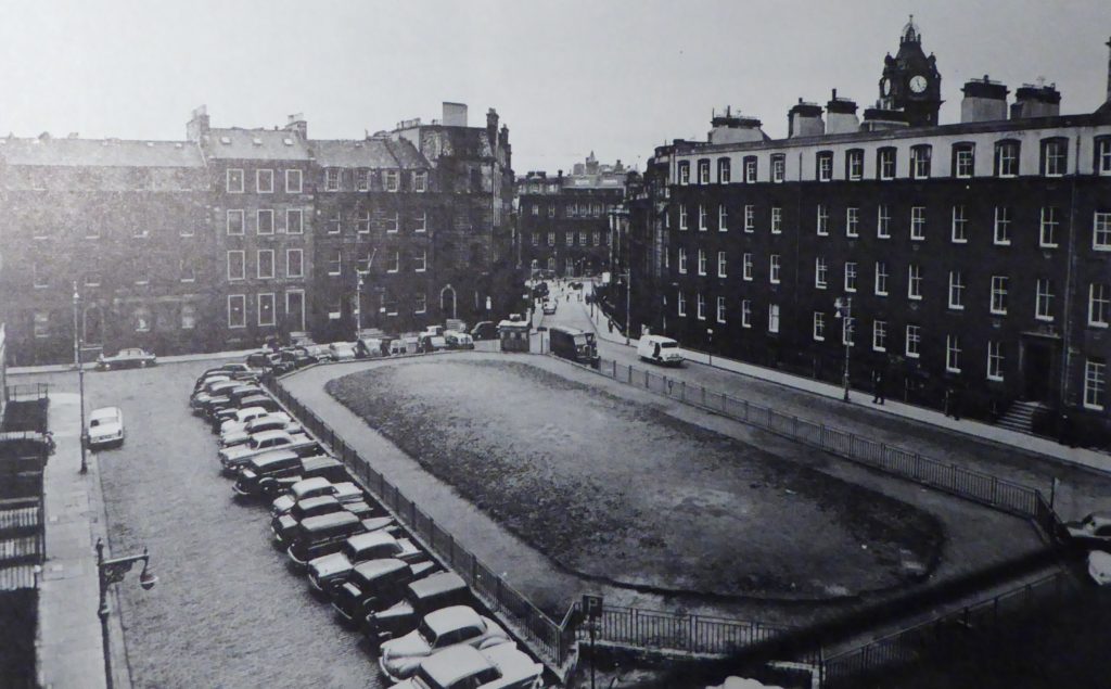 Black and white image of the old tenements around the garden of St James