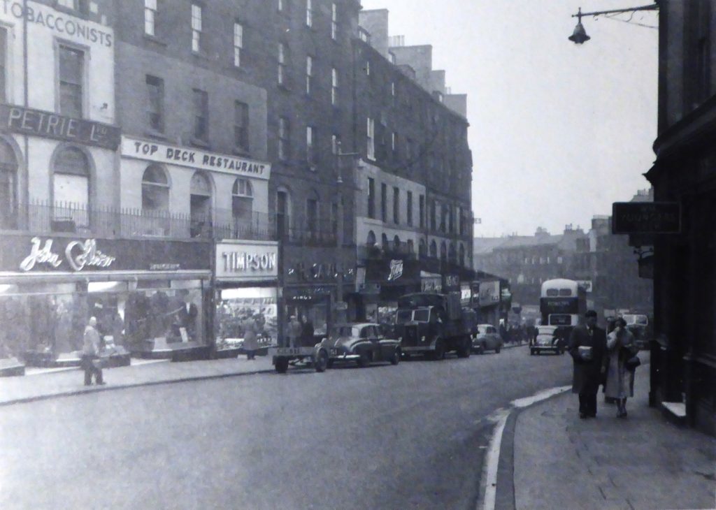 Black and white image of shops in Leith Street