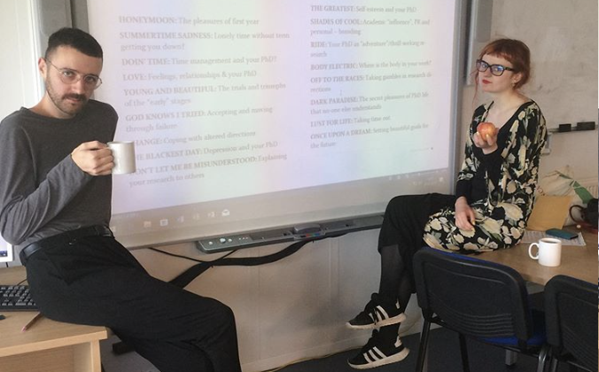 Maria Sledmere and Conner Milleken at the white board
