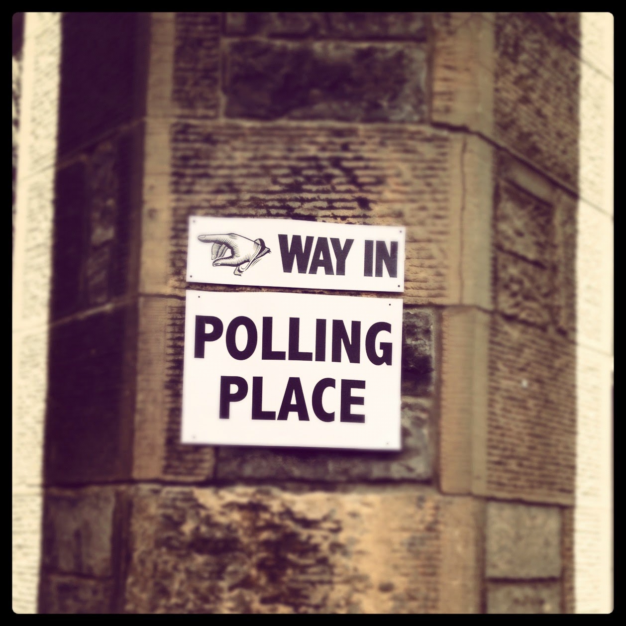 A sign at an general election polling station in Edinburgh shows a hand pointing towards the Way In to the Polling Place