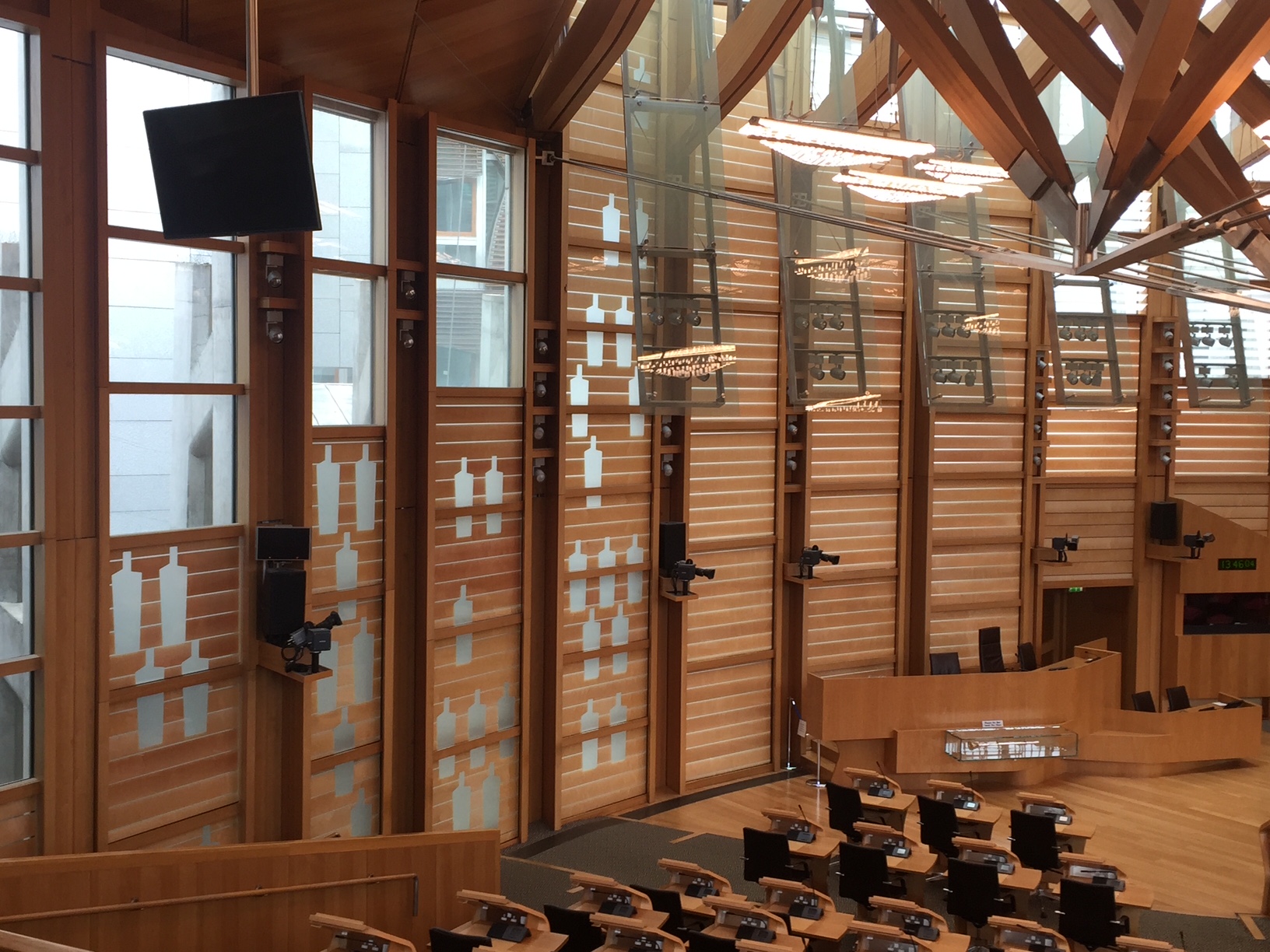 Scottish Parliament debating chamber, the symbols on teh wall indicate voters