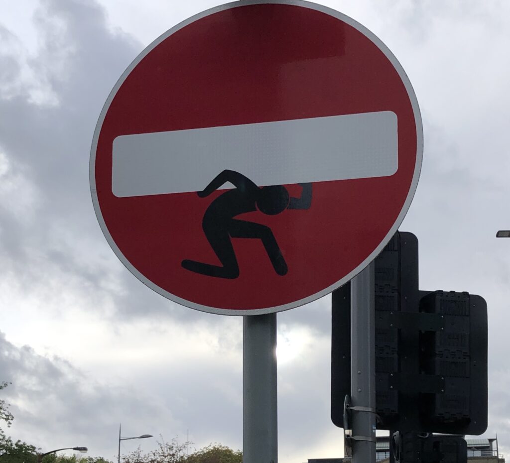Street artist Clet Abraham's adapted roadsign in central Edinburgh. Photo Fay Young